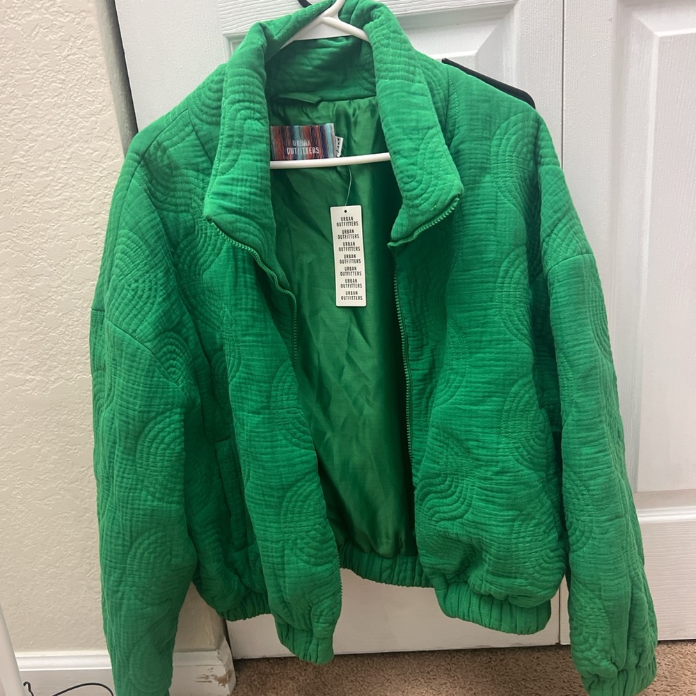 urban outfitters green zip up jacket with an embroidered swirl pattern